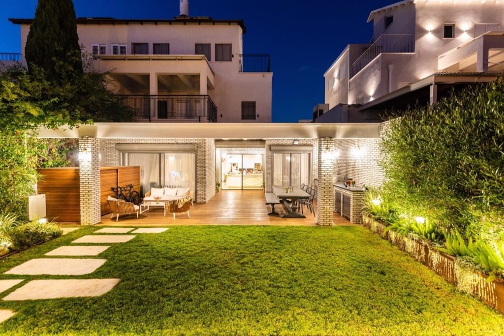 Modern landscaped garden with greenery and outdoor design features.